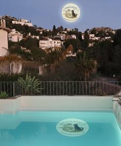 a frisbee is flying over a swimming pool at CocoHills in Monte Pego