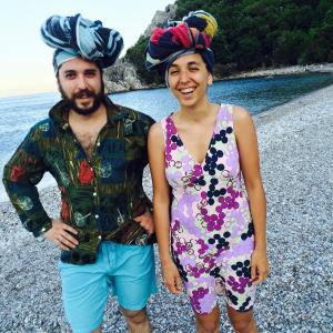 a man and woman standing on a beach with hats on their heads at Olympos Koyevi Pension in Olympos