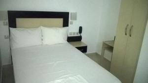 Postel nebo postele na pokoji v ubytování Hotel Dellis