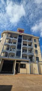 a large apartment building with a lot of windows at Massa Residence Meublé Yaounde in Yaoundé