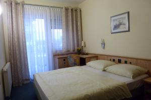 Postel nebo postele na pokoji v ubytování Hotel Ring Park