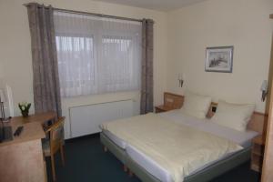 Postel nebo postele na pokoji v ubytování Hotel Ring Park