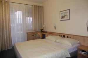 Postel nebo postele na pokoji v ubytování Hotel Ring Park