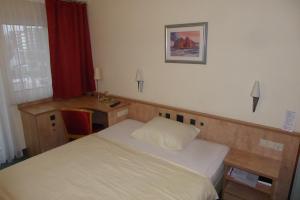 Postel nebo postele na pokoji v ubytování Hotel Ring Park