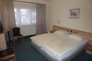 Postel nebo postele na pokoji v ubytování Hotel Ring Park