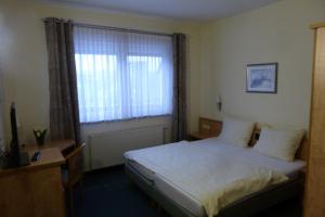 Postel nebo postele na pokoji v ubytování Hotel Ring Park