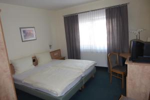 Postel nebo postele na pokoji v ubytování Hotel Ring Park