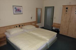 Postel nebo postele na pokoji v ubytování Hotel Ring Park