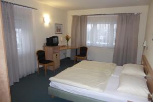 Postel nebo postele na pokoji v ubytování Hotel Ring Park