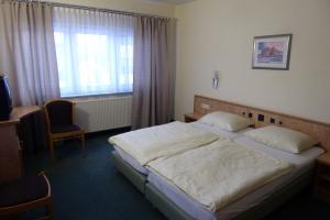 Postel nebo postele na pokoji v ubytování Hotel Ring Park