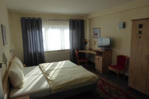 Postel nebo postele na pokoji v ubytování Hotel Ring Park
