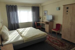 Postel nebo postele na pokoji v ubytování Hotel Ring Park