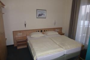 Postel nebo postele na pokoji v ubytování Hotel Ring Park