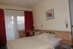 Postel nebo postele na pokoji v ubytování Hotel Ring Park