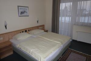 Postel nebo postele na pokoji v ubytování Hotel Ring Park