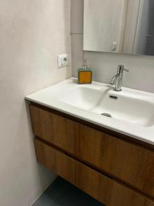 a bathroom with a sink and a mirror at Correri 125 in Modica +18 photos