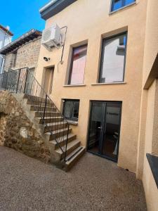 a building with a staircase in front of a building at Le Rococo f2 climatisé plein centre in Monistrol-sur-Loire