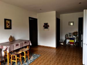 a dining room with a table and some chairs at Casa Isabela in Ocna Sibiului