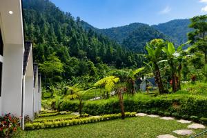 a view of a mountain from a house at ULYAKABIN Glamping Tawangmangu Private Pool Air Hangat Plus BBQ in Tawangmangu