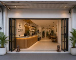 a store front with a lobby with plants at Chu-Cha's Samui - Boutique stay in Bophut