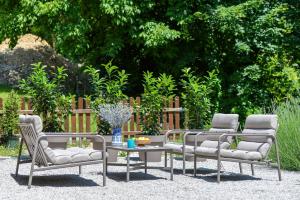 three chairs and a coffee table in a yard at Country home Lagom in Zagorska Sela
