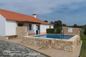 een zwembad voor een huis bij Akivillas Aljezur Nature in Aljezur