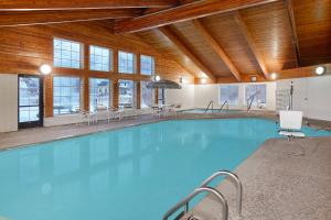 The swimming pool at or close to AmericInn by Wyndham Douglas/Saugatuck