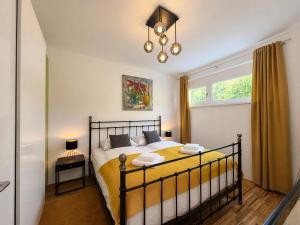 a bedroom with a bed and a window at Bergzauber am Semmering in Semmering