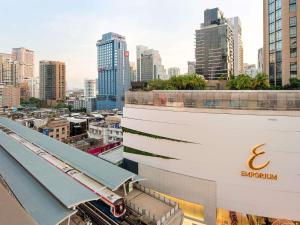 a view of a city skyline with a train station at ibis Bangkok Sukhumvit 24 in Bangkok