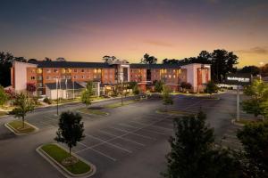 an aerial view of a building with a parking lot at Residence Inn by Marriott Augusta in Augusta