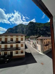 a view of a town with mountains in the background at La Cascata in Valbrenta  +12 photos