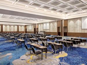 a large room with tables and chairs in it at Mercure Bengkulu in Bengkulu +69 photos