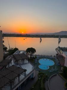 a view of a large body of water at sunset at Lotus Luxor Hotel in Luxor