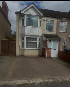 a house with a driveway in front of it at Quiet room Nr 1 in Coventry