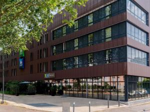 an office building with a lot of windows at Ibis Styles Rouen Centre Rive Gauche in Rouen