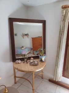 a mirror sitting on a table in a room at Nature Home Maitreya in Lorca +88 photos