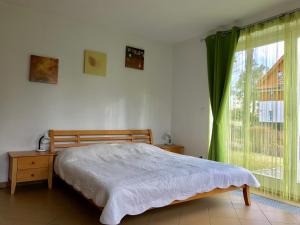 Posteľ alebo postele v izbe v ubytovaní Apart Riviera Lipno J4-12
