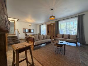 a living room with a couch and a table at City Retreat Arusha in Arusha