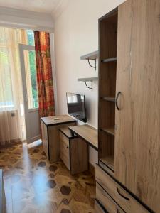 an office with a desk and a computer in a room at Golden Sunset Batumi Private Pool Villa in Batumi