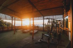 a gym with a view of the ocean at Anna Villas by Sumba-Beach in Memboro