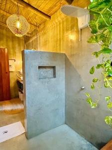 a room with a wall with a door in it at Casa Preguiça Corumbau in Corumbau +138 photos