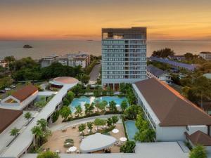 an aerial view of a resort with a building at Mercure Rayong Lomtalay Villas & Resort in Mae Pim +271 photos