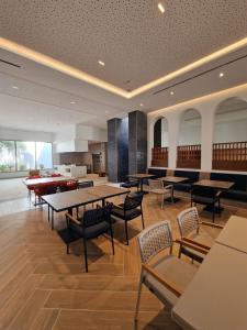 a dining room with tables and chairs in a building at Seabel Alhambra Beach Golf & Spa in Port El Kantaoui +68 photos