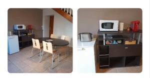 a kitchen and a dining room with a table and a microwave at Chambres d'hôtes le Brensole in Brens