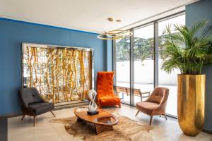 a living room with chairs and a table at GINO Seaside Tbilisi, Trademark Collection by Wyndham in Tbilisi City