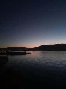 a view of a large body of water at sunset at Suma Kusi en el Titicaca in Puno +1 photo