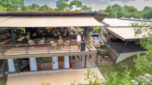 an overhead view of a building with a balcony at Surana Mara Camp in Mara Simba