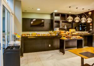 a restaurant with a counter with food on it at Aera Rio de Janeiro Copacabana in Rio de Janeiro +23 photos