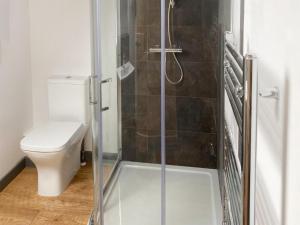 a bathroom with a glass shower with a toilet at The Mill House Uk47418 in Curry Mallet