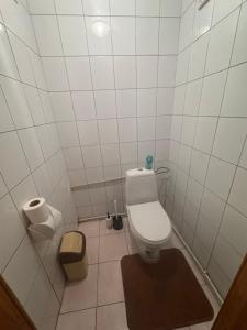 a bathroom with a toilet and two rolls of toilet paper at Дім дача біля води in Protsev +9 photos
